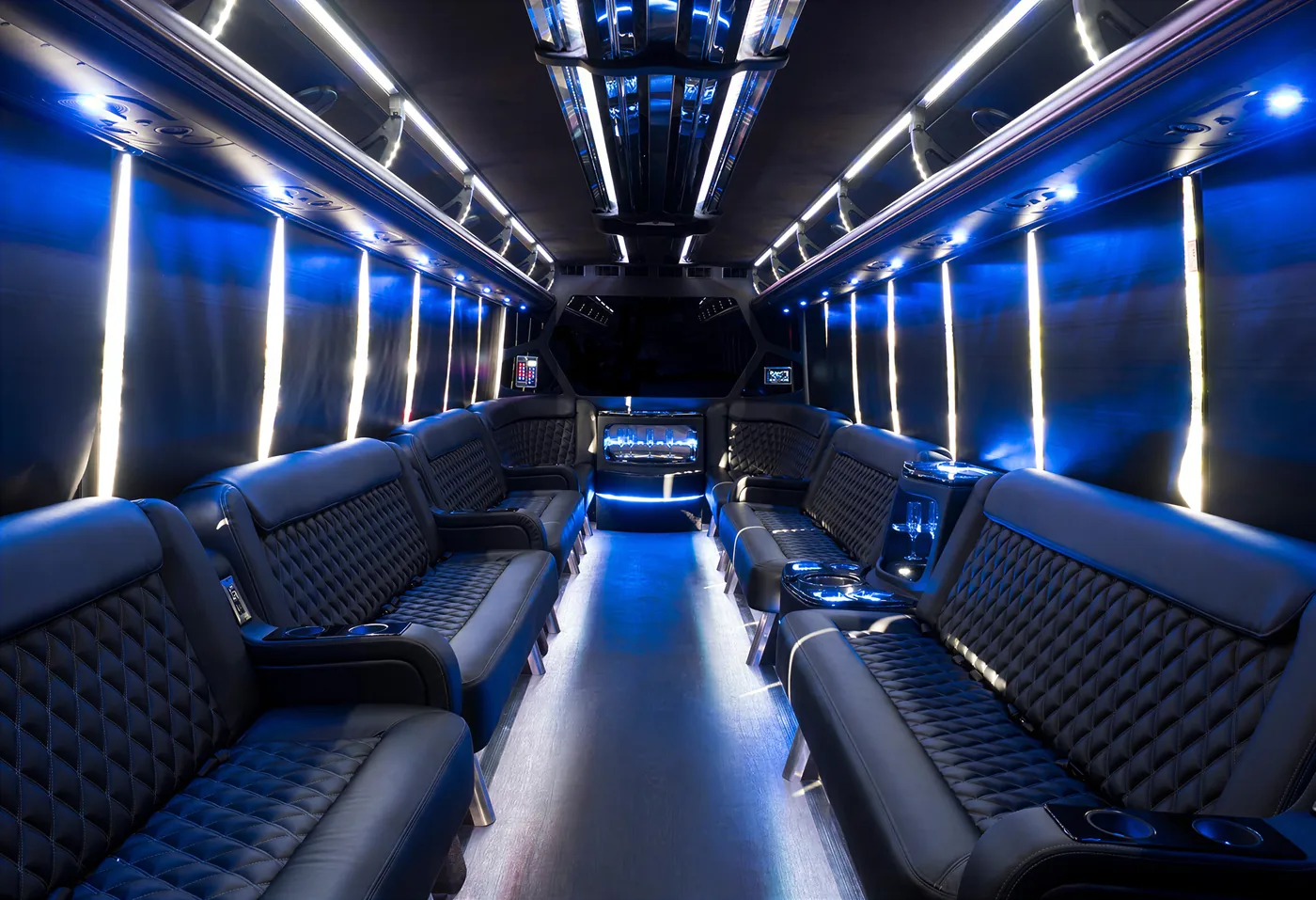 Modern Temecula party bus interior with blue LED lighting and wraparound seating