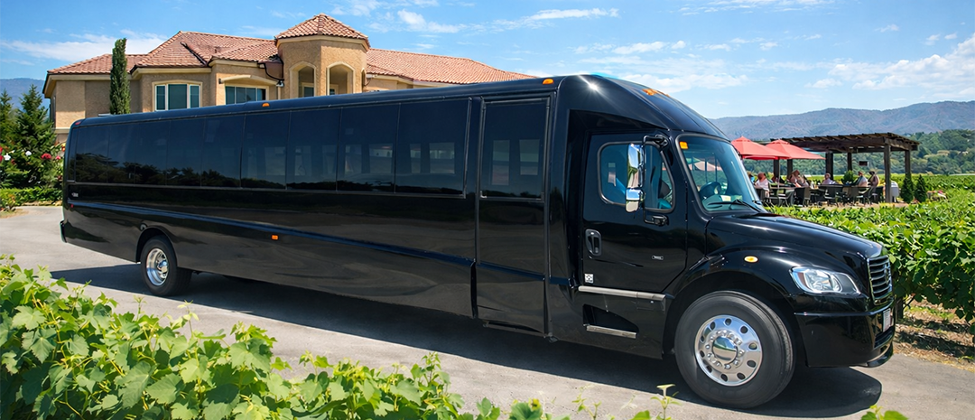 Black party bus parked at a winery in Temecula Valley for Southern California limo services